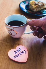 Classic Napoleon cake with coffee cup and the inscription good morning.