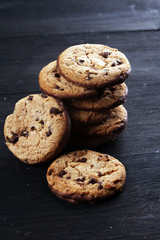 Chocolate cookies on wooden table. Chocolate chip cookies shot on table