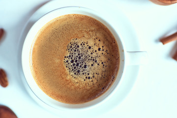 Breakfast with coffee and croissants on wooden table, top view