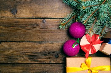 Christmas decoration and boxes on wooden background. Top view, copy space
