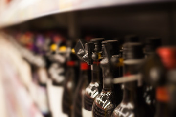 Obraz na płótnie Canvas shelf with bottles of wine in a supermarket
