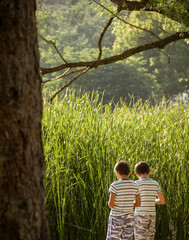 two little brothers hanging out alone in the woods © yusufkasik