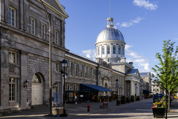 Naklejka premium MONTREAL CANADA June 25, 2018: Bonsecours Market (Marche) in Old Montreal, Quebec, Canada. It is the main public market in the Montreal area, and accommodated the Parliament of United Canada in 1849.
