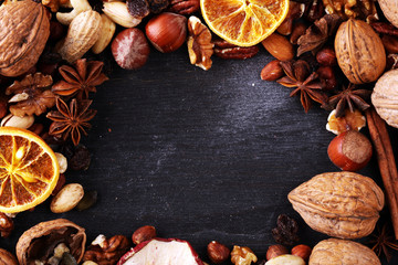 Fototapeta na wymiar Composition with dried fruits and assorted healthy nuts on rustic background for christmas