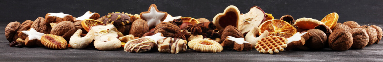 Decoration with christmas cookies. Typical cinnamon stars with fruits and nuts cinnamon