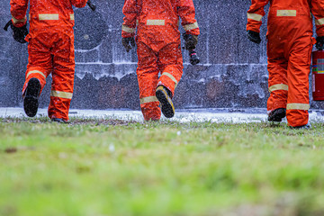 Fototapeta premium fire flighter training spray water to fire