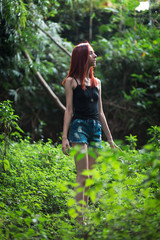 Naklejka na ściany i meble a skinny redhead girl in a brazilian forest