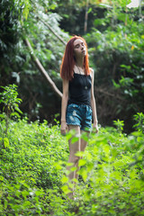 Naklejka na ściany i meble a skinny redhead girl in a brazilian forest
