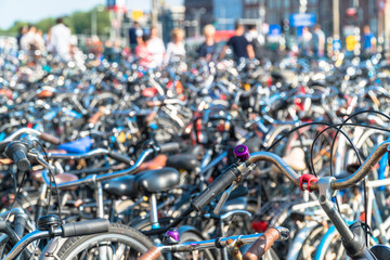 Fototapeta na wymiar Amsterdam, North Holland / Netherlands - June 22nd, 2019: Hundreds of bicycles parked in downtown