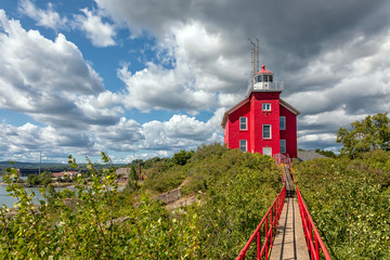 Marquette Harbor Lighthouse with catwalk on a sunny summer day