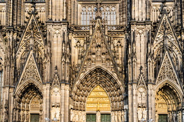 Fototapeta premium Sculptures and carvings on the facade of the gothic cathedral a UNESCO world heritage site in Cologne, Germany
