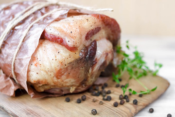 Homemade baked pork ham with aromatic herbs. Festive traditional dish and Keto diet food.