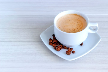 Coffee in cup and coffee beans, isolated spread on a white background.
