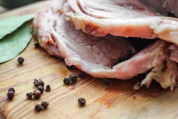 Homemade baked pork ham with aromatic herbs. Festive traditional dish and Keto diet food.