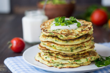 zucchini fritters healthy vegetable recipe, ingredients are zucchini, carrots, garlic, parsley and eggs