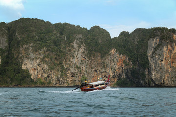 Fototapeta na wymiar Longtail boat from Ao Nang in the water near Railay beach, Krabi