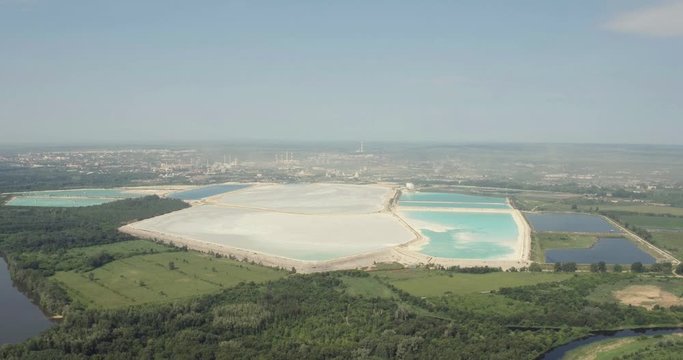 The largest factory in the world of baking soda (bicarbonate) / big blue reservoir - Aerial drone view