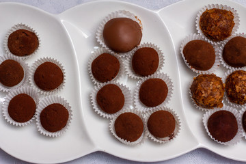 Chocolate truffles in a beautiful plate on the table