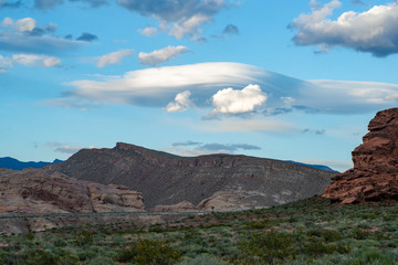 USA, Nevada, Clark County, Gold Butte National Monument. A lenticular cloud hovers over Billy Goat Peak and the Whitney Ridge.