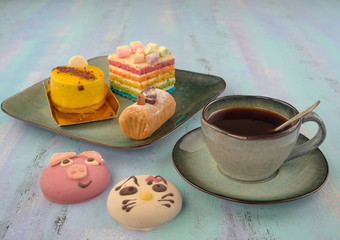Beautiful and delicious cakes.Black coffee.On light background