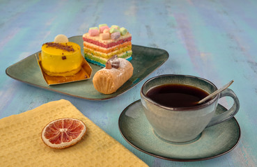 Beautiful and delicious cakes.Black coffee.On light background
