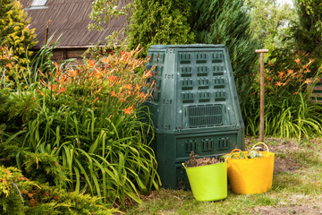 Compost bin and mulch in a summer garden