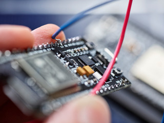 Detail of hand holding circuit board