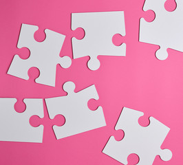 white large blank puzzles on a pink background