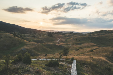 Beautiful countryside sunset on the top of the mountain