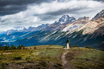 Woman hiking a trail of Canadian Rockies in Banff National Park, Alberta, Canada