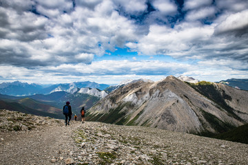 Fototapeta premium Hikers on a trail of the Canadian Rockies in Jasper National Park, Alberta, Canada