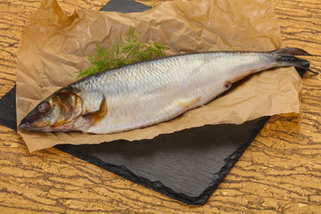 Salted herring over the wooden board