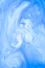 Abstract colored background, fluid design. Stains of paint on the water. Ebru art, marbled paper.