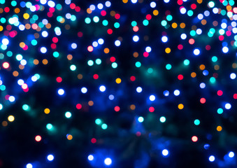 Abstract colorful bokeh texture on dark background