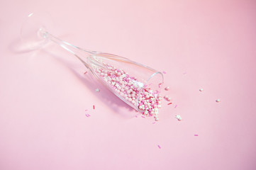 Colorful candy sprinkles in a champagne glass