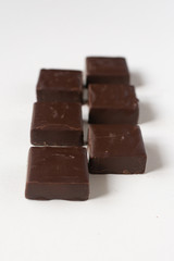 Chocolate candies on a white background.