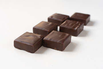 Chocolate candies on a white background.