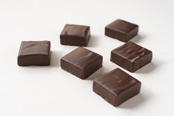 Chocolate candies on a white background.