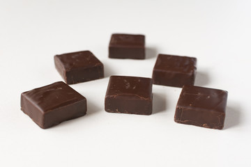 Chocolate candies on a white background.