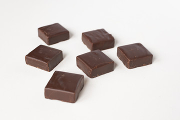 Chocolate candies on a white background.