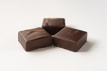 Chocolate candies on a white background.