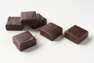 Chocolate candies on a white background.
