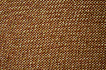 Texture of a woven material with with yellow and brown threads