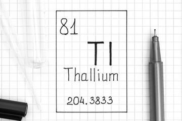 The Periodic table of elements. Handwriting chemical element Thallium Tl with black pen, test tube and pipette.