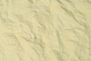 Fototapeta na wymiar Texture of corn flour. Yellow flour closeup.