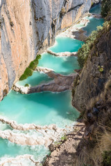 The bright blue colored natural pools of the Millpu Blue Lagoons, Ayacucho, Peru