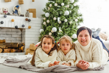 Portrait of friendly family on Christmas evening