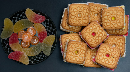 Sweets.Cookies and marmalade on a plate.
