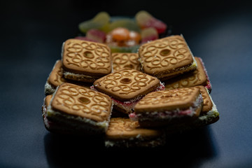 Tasty biscuits with filling on a plate
