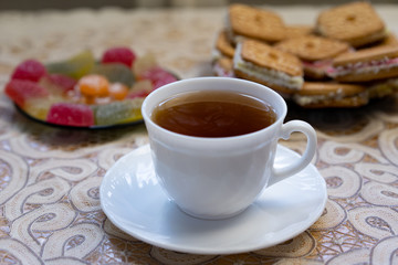 Tea with sweets. Cookies, marmalade, candies.
